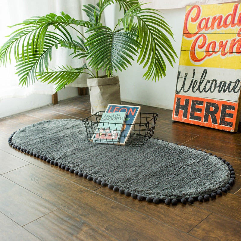Pom-pom Trimmed Oval Anti-skid Rug Dark Grey