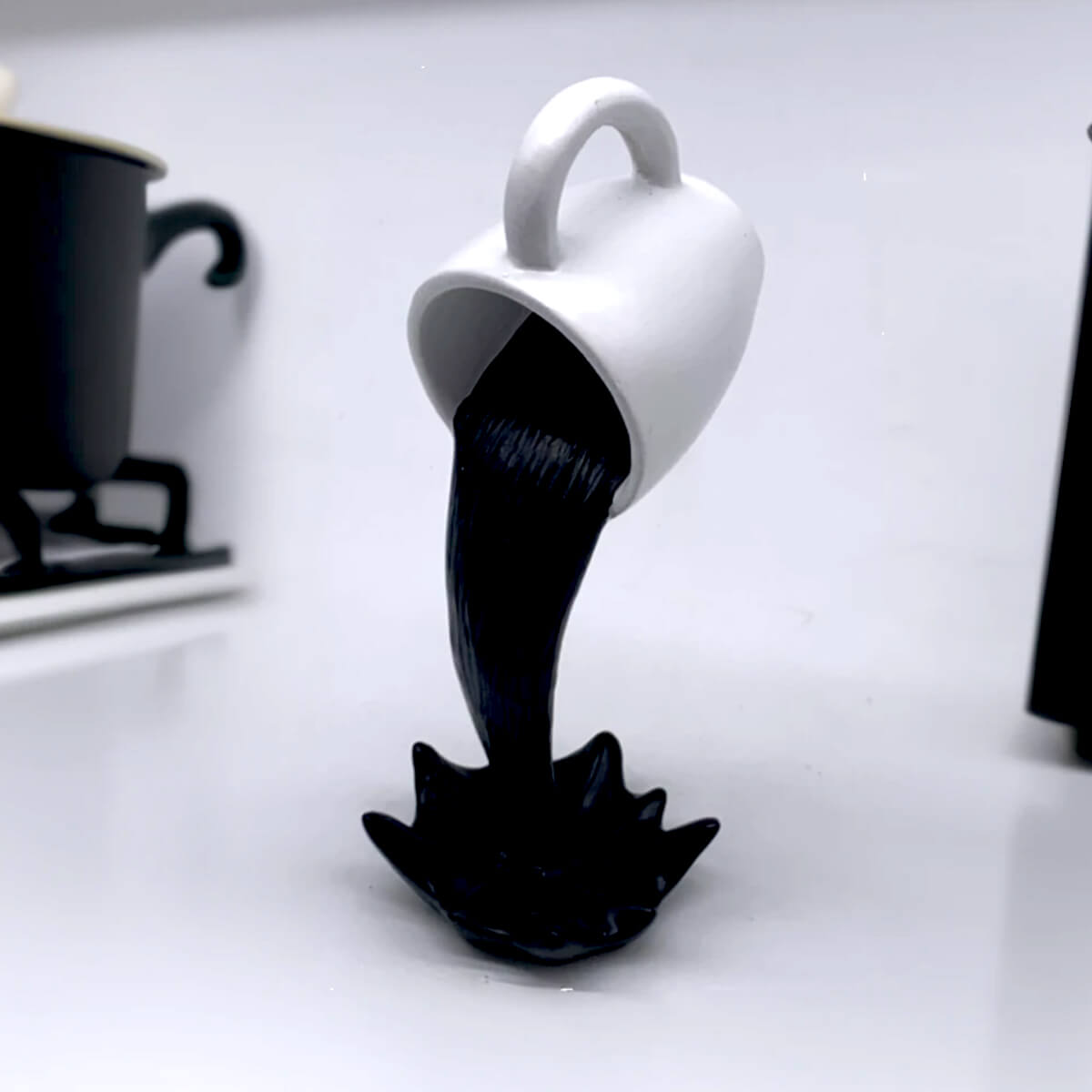Floating Spilling Coffee Cup Black